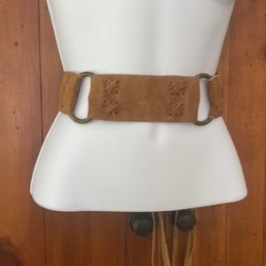 Genuine Italian leather with rings in between each strap. Vintage